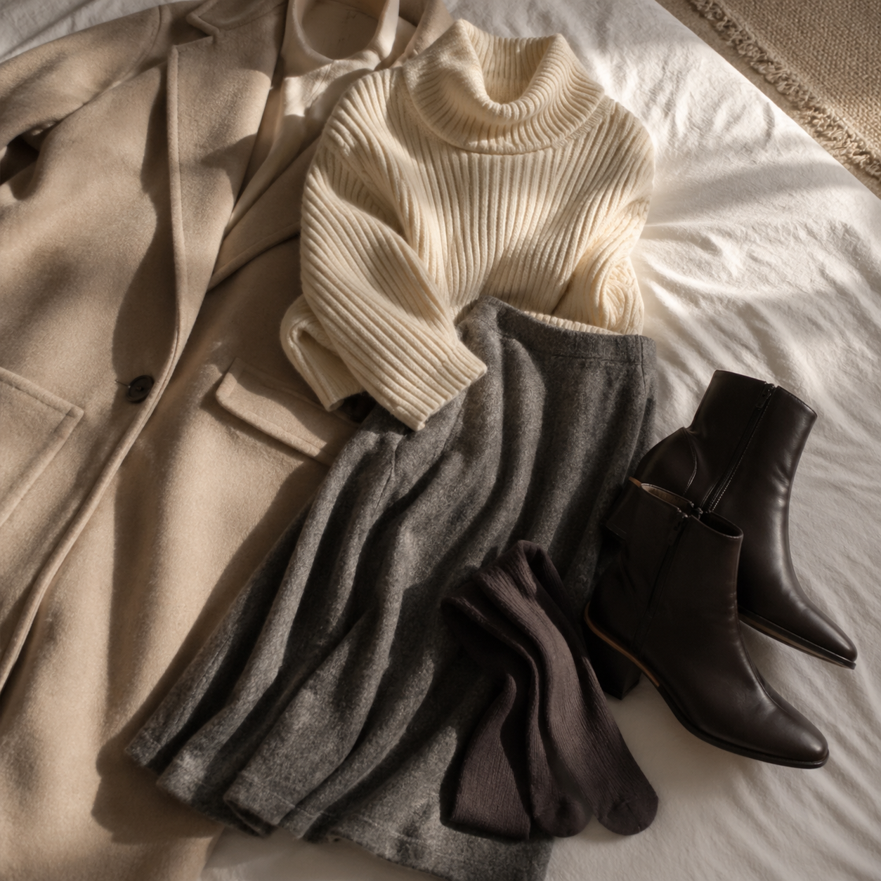 Skirt and Knitwear Proportions for Cooler Days visual with refined wardrobe shapes, fabric texture, and calm editorial color.