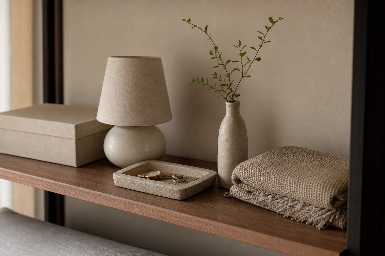 Small home gifts with compact lamp, tray, folded textile, and plant